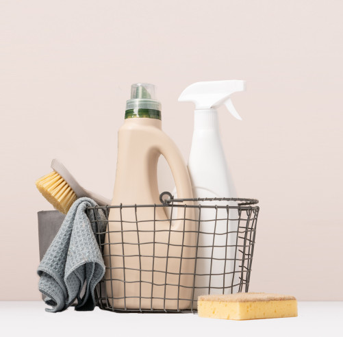 Set of eco-friendly cleaning tools on beige background with gree